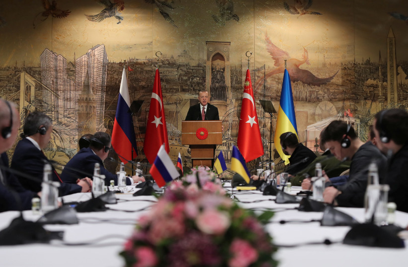 Turkish President Tayyip Erdogan addresses Russian and Ukrainian negotiators before their face-to-face talks in Istanbul, Turkey March 29, 2022 (credit: MURAT CETINMUHURDAR/PRESIDENTIAL PRESS OFFICE/HANDOUT VIA REUTERS)