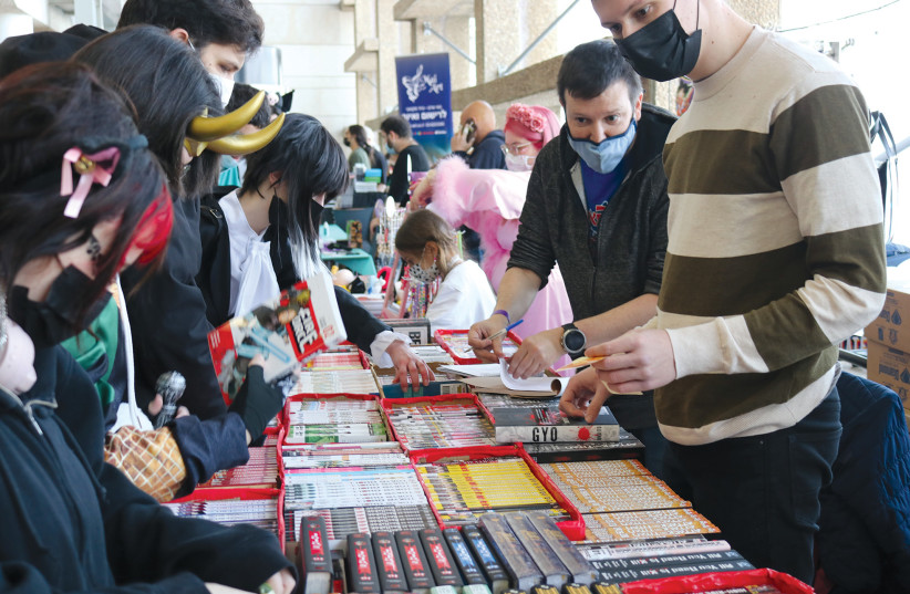  ISRAELI FANS line up to buy comics, manga and other merchandise at the convention. (credit: Naomika Goldkin)
