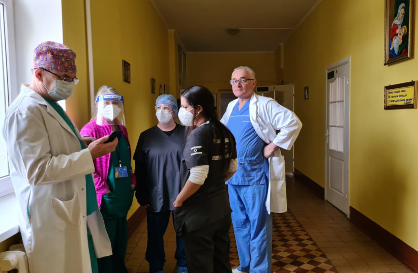  The medical team prepare in the Field Hospital ahead of the C-Section surgery. (credit: NAAMA FRANK AZRIEL)