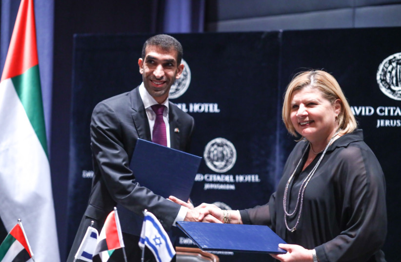  Economy Minister Orna Barbivai and Emirati foreign trade minister Thani bin Ahmed Al Zeyoudi sign a free-trade agreement between Israel and the UAE (photo credit: GIDEON SHARON / GPO)