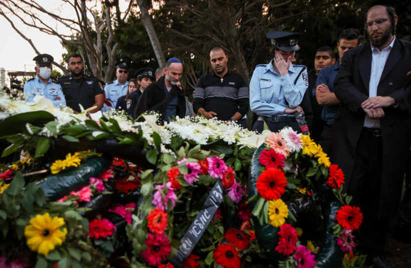  People pay their respects during the funeral of Police officer Amir Huri who was killed in a terrorist shooting attack in Bnei Brak, at the cemetery in Nof Hagalil, March 31, 2022.  (credit: DAVID COHEN/FLASH 90)