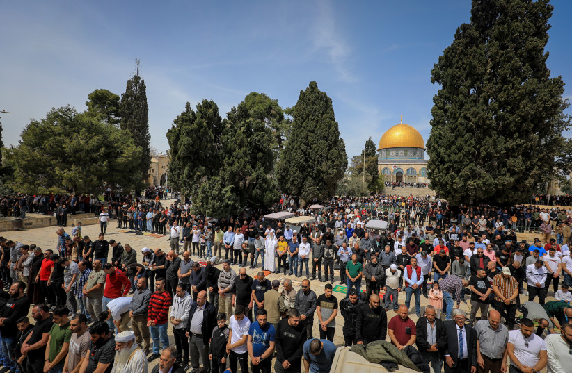  Palestinians attend Friday prayers at the Al-Aqsa Mosque compound in the Old City of Jerusalem, on April 1, 2022.  (credit: JAMAL AWAD/FLASH90)