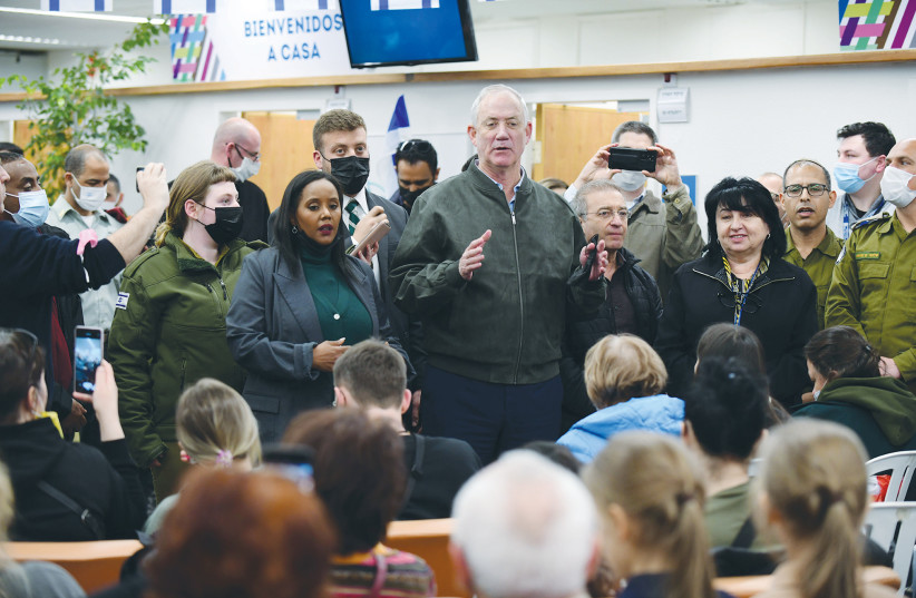  DEFENSE MINISTER Benny Gantz, with Aliyah and Integration Minister Pnina Tamano-Shata at his side, addresses Jewish immigrants fleeing Ukraine at the immigration and absorption office of Ben-Gurion Airport last month.  (photo credit: TOMER NEUBERG)