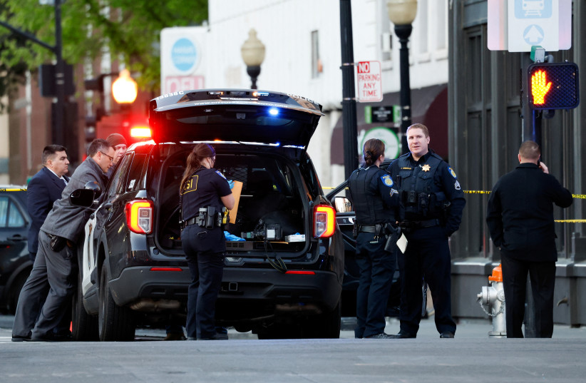  Police are seen after an early-morning shooting in a stretch of the downtown near the Golden 1 Center arena in Sacramento, California, US April 3, 2022. (photo credit: REUTERS/FRED GREAVES)
