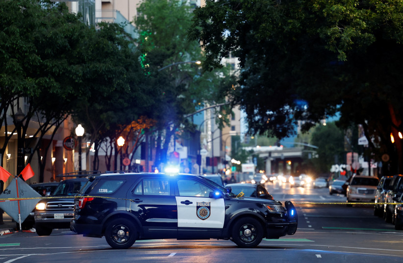  Police are seen after an early-morning shooting in a stretch of the downtown near the Golden 1 Center arena in Sacramento, California, US April 3, 2022. (credit: REUTERS/FRED GREAVES)