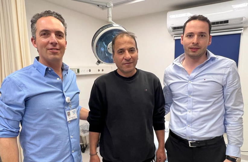   Dr. Gronovich (left), next to the patient, with Dr. Gilad Winder at right. (credit: SHAARE ZEDEK MEDICAL CENTER)