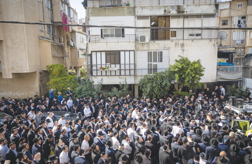  THE FUNERAL of Avishai Yehezkel, which took place last week, a day after he was murdered in a terrorist shooting attack in Bnei Brak. I am grateful to be part of a society that mourns its casualties together, writes the author.  (photo credit: YONATAN SINDEL/FLASH90)