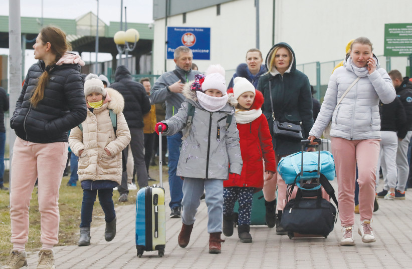  REFUGEES ARRIVE at the border crossing between Poland and Ukraine, after Russia launched its massive military operation against Ukraine in late February.  (credit: KACPER PEMPEL/REUTERS)