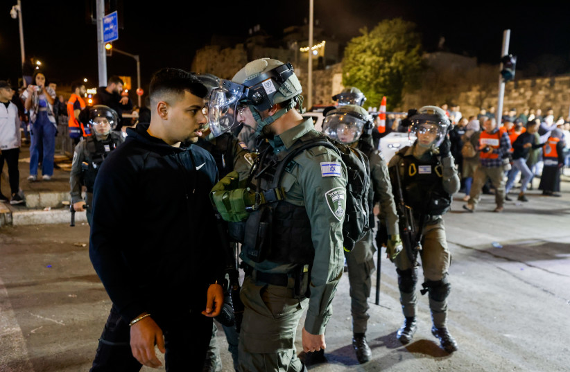  Israeli police officers seen during clashes with protesters at Damascus Gate in Jerusalem's Old City, during the holy Muslim month of Ramadan, April 3, 2022. (photo credit: OLIVIER FITOUSSI/FLASH90)