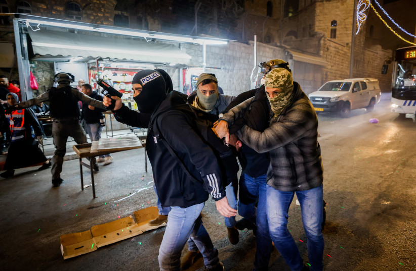  Israeli police officers seen during clashes with protesters at Damascus Gate in Jerusalem's Old City, during the holy Muslim month of Ramadan, April 3, 2022. (photo credit: OLIVIER FITOUSSI/FLASH90)