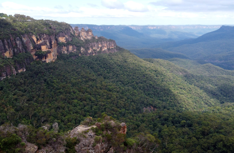  Drone photograph of the Jamison Valley and the Three Sisters rock formation in the Blue Mountains, New South Wales, Australia, February 1, 2021. (photo credit: REUTERS/STEFICA NICOLE BIKES)
