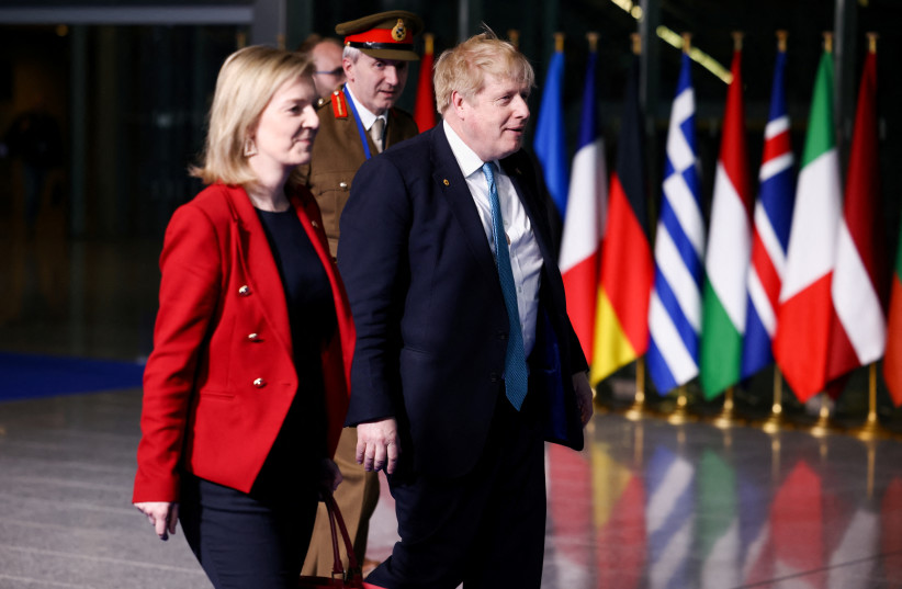  British Prime Minister Boris Johnson, Foreign Secretary Liz Truss and military representative to NATO Ben Bathurst leave NATO Headquarters following a summit on Russia's invasion of Ukraine, in Brussels, Belgium March 24, 2022. (credit: REUTERS/HENRY NICHOLLS)