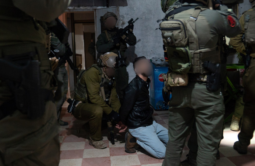  Lotar Eilat making an arrest. (credit: IDF SPOKESPERSON'S UNIT)