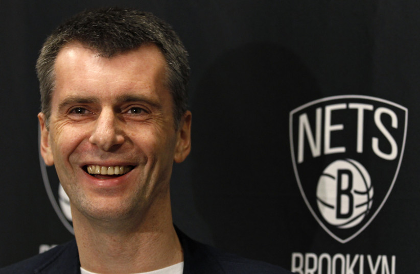  Brooklyn Nets owner Mikhail Prokhorov smiles during an interview before the Nets take on the Minnesota Timberwolves in their NBA basketball game in New York November 5, 2012 (photo credit: ADAM HUNGER/REUTERS)