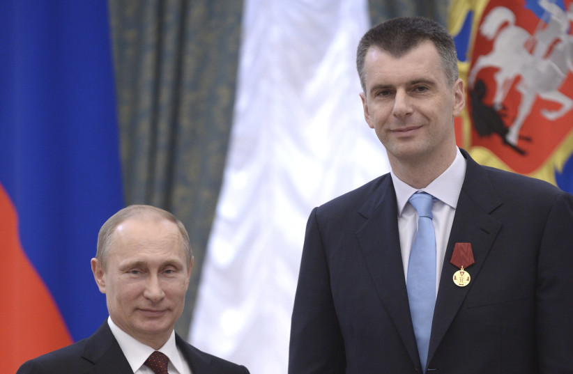  Russian President Vladimir Putin stands with businessman-turned-politician Mikhail Prokhorov during a state awards ceremony in Moscow's Kremlin on March 24, 2014 (credit: REUTERS/ALEXEI NIKOLSKIY/RIA NOVOSTI/KREMLIN)