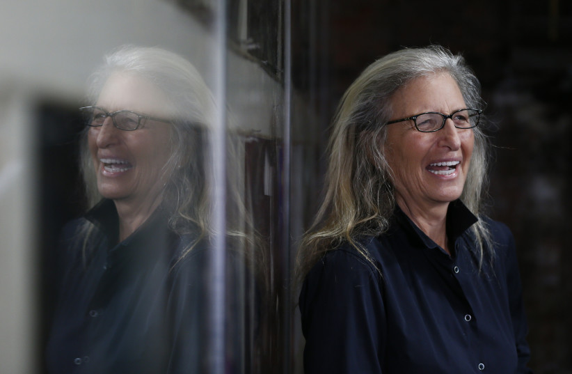 US photographer Annie Leibovitz is reflected in glass during a press preview of her exhibition 'WOMEN: New Portraits' at Wapping Hydraulic Power Station in London, Britain, January 13, 2016. (credit: REUTERS/STEFAN WERMUTH)