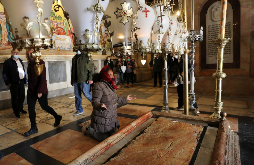 Christian worshippers mark Good Friday in Jerusalem's Old City (photo credit: AMMAR AWAD/REUTERS)