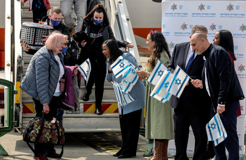  An elderly Ukrainian immigrant is greeted by Israeli Minister of Immigration and Absorption Pnina Tamano-Shata after arriving at Ben Gurion Airport in Lod, Israel February 20, 2022 (photo credit: REUTERS/NIR ELIAS)