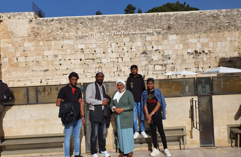  FALAK, SAJID, Farah, Parker and Charrish (left to right) pose in this photo in front of the Western Wall.  (photo credit: DON SHRENSKY)