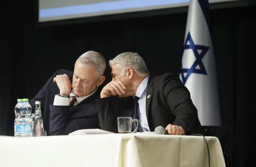  Foreign Minister Yair Lapid and Defense Minister Benny Gantz in a briefing on Iran to ambassadors from 80 countries, April 6, 2022  (photo credit: SIVAN SHACHOR)