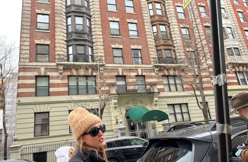  Samantha Rose Hill, a biographer of Hannah Arendt, leads a walking tour to 317 W. 95th Street in Manhattan, Hannah Arendt's first home after she arrived in America as a stateless refugee, March 27, 2022.  (credit: NEW YORK JEWISH WEEK)
