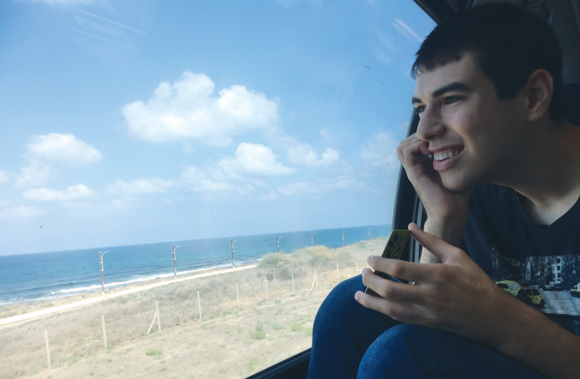  DANNY ENJOYS watching the view out the window during a train ride. (photo credit: HANNAH BROWN)