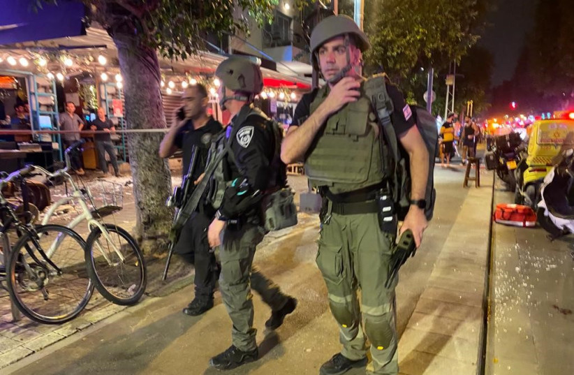  Police and rescue workers at the scene of a terror attack on Dizengoff street, central Tel Aviv. 5 were wounded in the shooting, 3 severely. April 07, 2022.  (credit: AVSHALOM SASSONI/FLASH90)