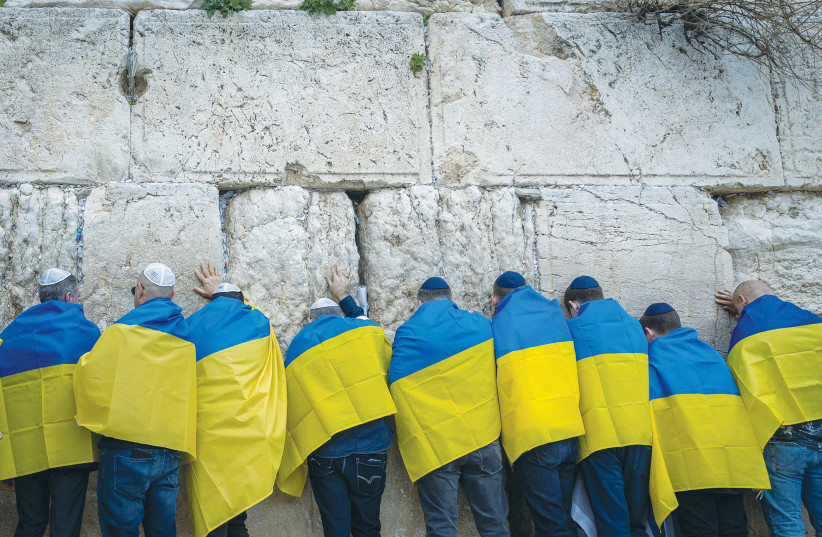  UKRAINIAN CITIZENS and supporters attend a special prayer for the Ukrainian people, organized by businessman Arie Schwartz, at the Western Wall last month. Among those in attendance was Ukrainian Ambassador to Israel Yevgen Korniychuk. (credit: YONATAN SINDEL/FLASH90)