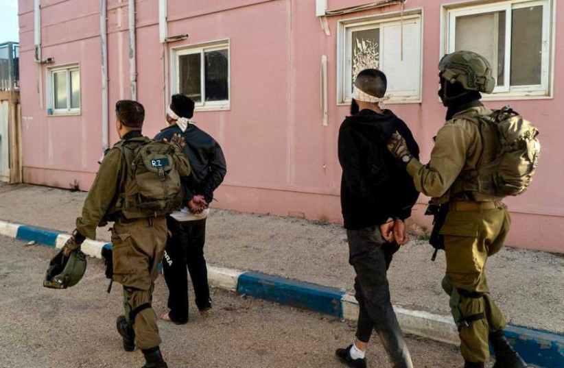  IDF arresting suspects in the West Bank suspected of connection with the terrorist who carried out the Tel Aviv terror attack, April 10, 2022.  (photo credit: IDF SPOKESPERSON UNIT)