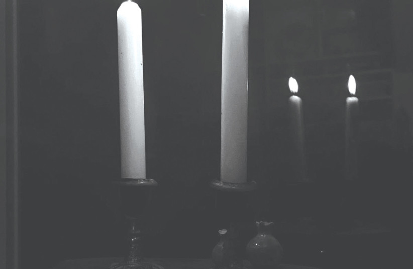  THE SHABBAT CANDLESTICKS given by the cantor are seen in this photo taken by the writer's daughter. (credit: HANNAH MANDELBAUM)