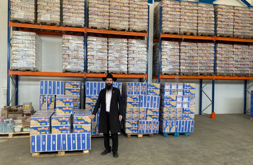  One of the Chabad rabbis of Moldova with the Matzas for Ukrainian and Moldovian Jewish communities.  (photo credit: MOLDOVA JEWISH COMMUNITY)