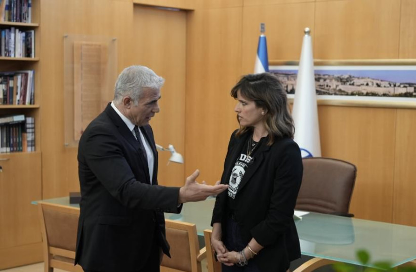  Foreign Minister Yair Lapid is seen with Israel's new antisemitism envoy Noa Tishby. (photo credit: BOAZ OPPENHEIM/GPO)