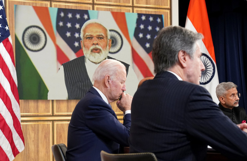 US President Joe Biden, seated with US. Secretary of State Antony Blinken and India's Foreign Minister Subrahmanyam Jaishankar, holds a videoconference with India's Prime Minister Narendra Modi to discuss Russia's war with Ukraine from the White House in Washington U.S., April 11, 2022.  (photo credit: REUTERS/KEVIN LAMARQUE)