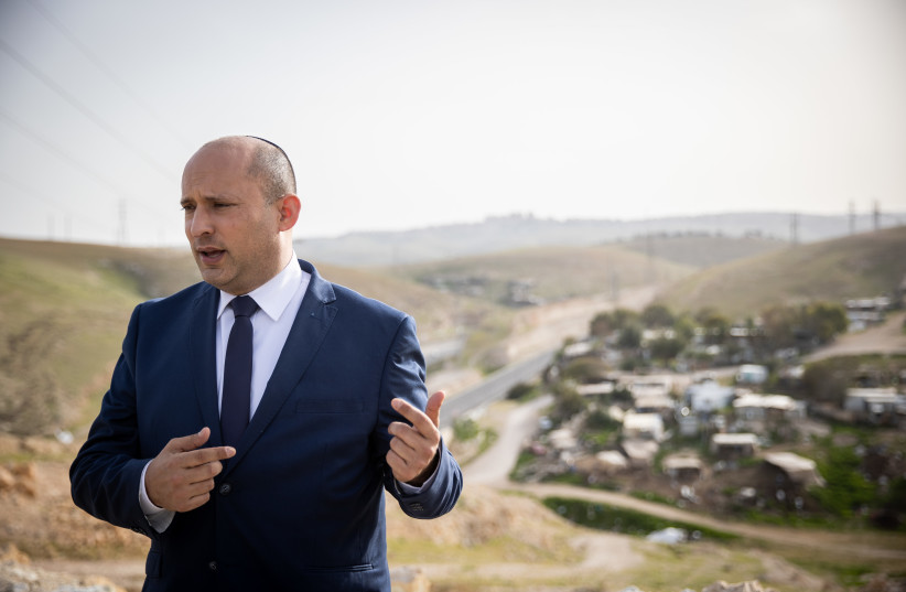  Head of the Yamina party Naftali Bennett at a conference of the Srugim news website above the  Bedouin village Khan al-Ahmar in the West Bank on March 21, 2021. (photo credit: YONATAN SINDEL/FLASH90)