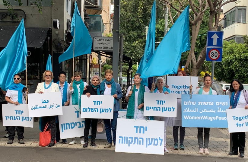  Dozens of Women Wage Peace activists, Jews and Arabs, holding a peace vigil near Ilka bar in Tel Aviv, April 12, 2022.  (photo credit: YAEL BRAUDO-BAHAT)