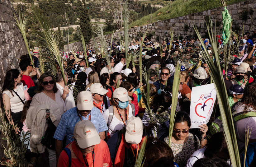  The Palm Sunday procession in Jerusalem, April 10, 2022. (photo credit: CRYSTAL DUNLAP/THE MEDIA LINE)