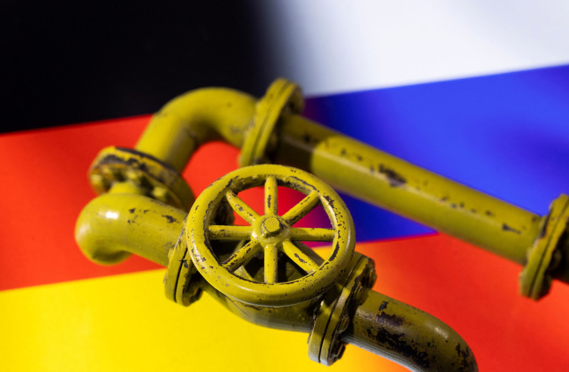  3D printed Natural Gas Pipes are placed on displayed German and Russian flags in this illustration taken, January 31, 2022. (photo credit: REUTERS/DADO RUVIC/ILLUSTRATION/FILE PHOTO)