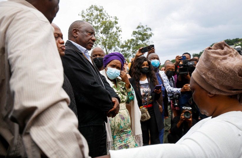 President Cyril Ramaphosa meets with people who lost family members during flooding in Clermont, Durban, South Africa, April 13, 2022. (credit: REUTERS/Rogan Ward)