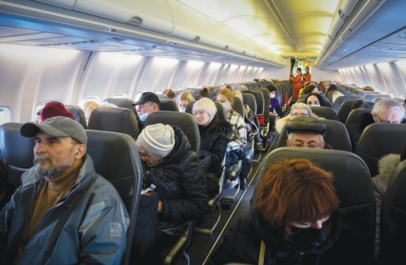  JEWISH UKRAINIANS who fled war zones in their country travel on board a rescue flight to Israel last month. (photo credit: YOSSI ZELIGER/FLASH90)