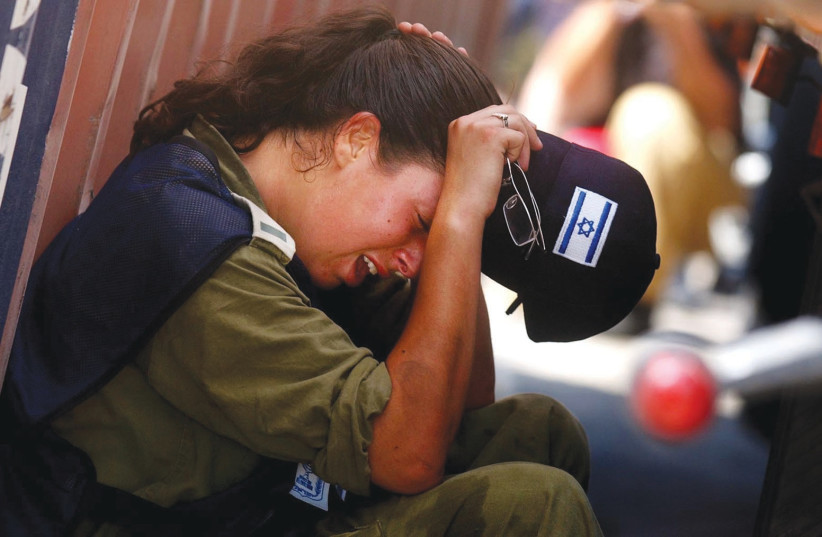  A SOLDIER CRIES during the evacuation of Neve Dekalim in 2005. Many Israelis believe Palestinian hatred of Israel and Jews increased after there were no Israelis left in Gaza. (photo credit: Pierre Terdjman/Flash90)