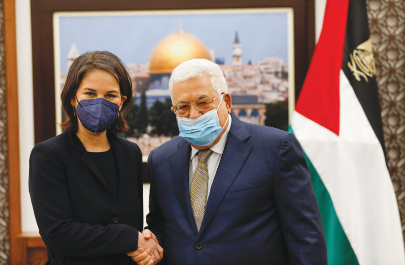  GERMAN FOREIGN Minister Annalena Baerbock meets with Palestinian Authority head Mahmoud Abbas in Ramallah, in February. (photo credit: MOHAMAD TOROKMAN/REUTERS)