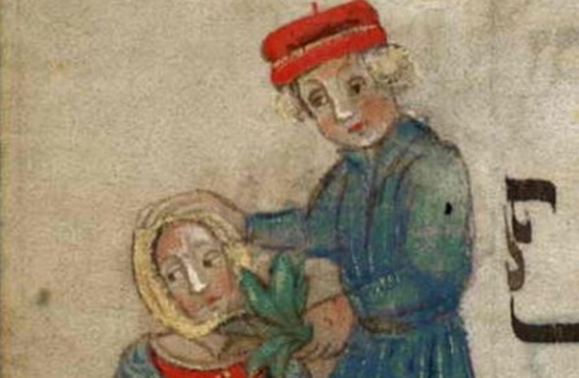  Closeup of the man and his wife, depicted as even “more bitter than death” as she wields a sword in the “Washington Haggadah“ (credit: LIBRARY OF CONGRESS)