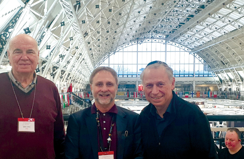  The writer (far right) with Eddie Liebu, an Israeli judge, and Ed Kroft, a Canadian judge, at the London 2022 International Stamp Exhibition. (photo credit: COURTESY LES GLASSMAN)