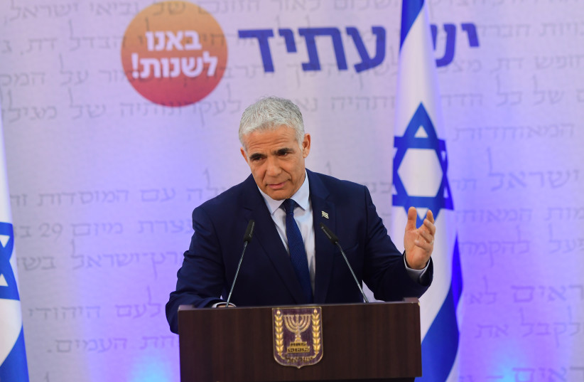 Head of the Yesh Atid party and Israeli foreign minister, Yair Lapid, holds a press conference in Tel Aviv on April 14, 2022. (photo credit: AVSHALOM SASSONI/FLASH90)