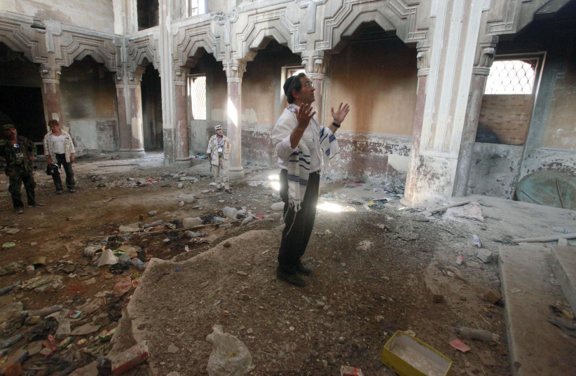  LIBYAN JEWISH exile David Gerbi prays inside Dar Bishi synagogue in Tripoli, 2011. Gerbi and his family fled Tripoli when the Six Day War broke out in 1967. Most Tripoli synagogues were destroyed or converted to mosques.  (photo credit: SUHAIB SALEM/REUTERS)