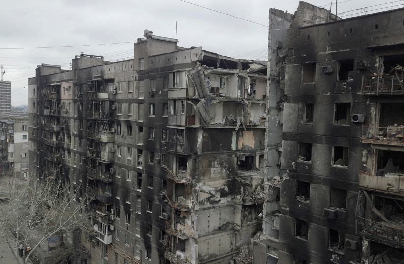 A view shows a residential building destroyed in the course of Ukraine-Russia conflict in the southern port city of Mariupol, Ukraine, April 14, 2022. (credit: REUTERS/PAVEL KLIMOV/FILE PHOTO)