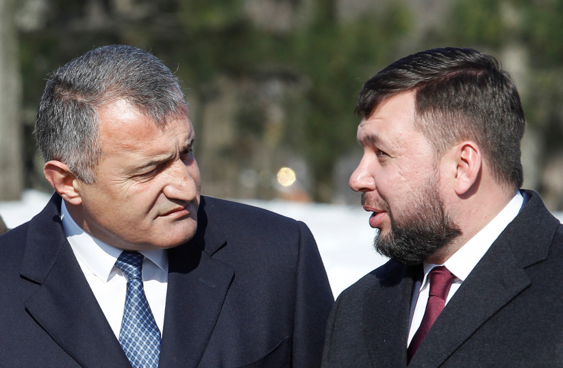  Head of the self-proclaimed Donetsk People's Republic Pushilin and leader of Georgia's breakaway region of South Ossetia Bibilov attend a ceremony in Donetsk (photo credit: REUTERS)