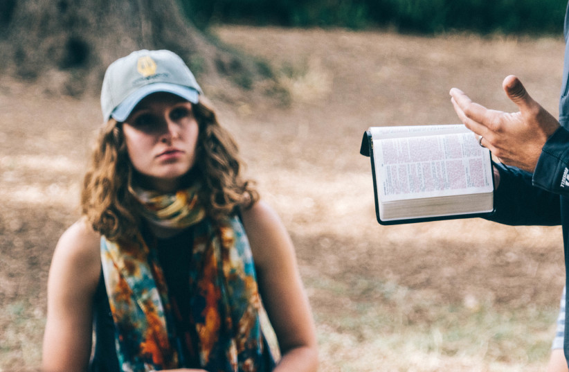  A Christian student studies the Bible in Israel during a Passages trip (credit: PASSAGES)