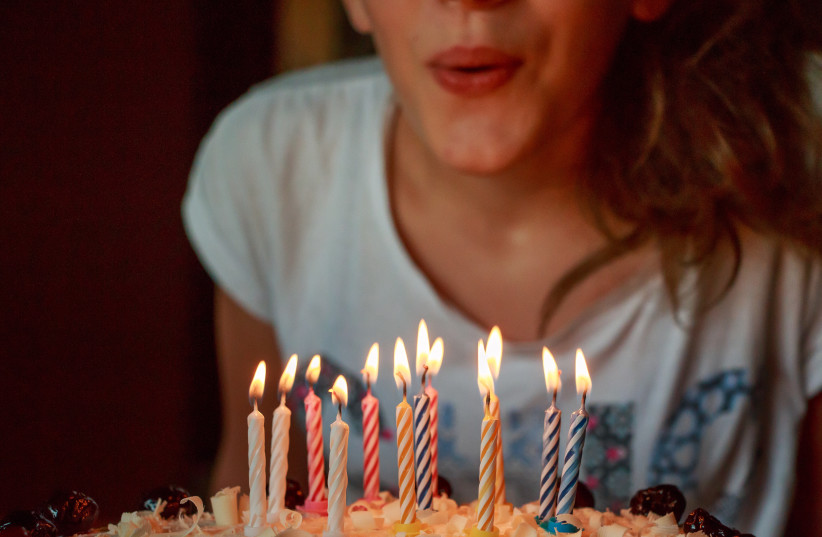  Illustrative photo of a girl blowing out birthday cake candles.  (credit: PXHERE)