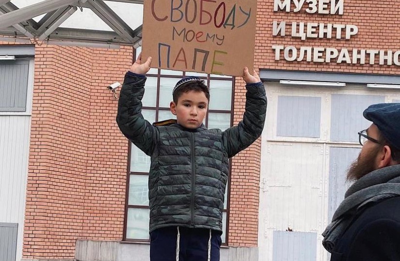  The son of Revaz Raphael Shmertz protesting w a sign that says ''freedom for my father.'' (credit: SHMERTZ FAMILY)